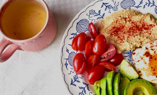 Keto-friendly meal with green tea in a mug