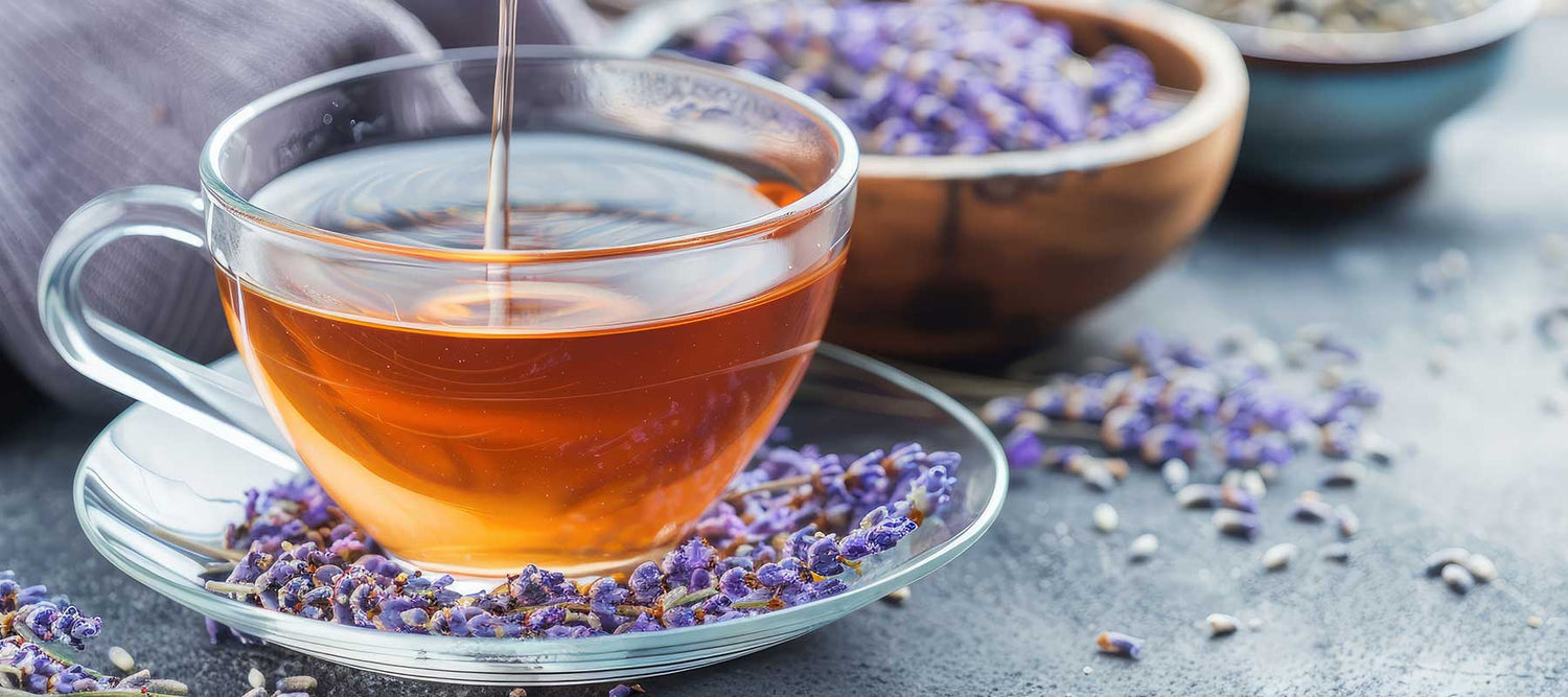 Cup of floral tea with lavender blossoms