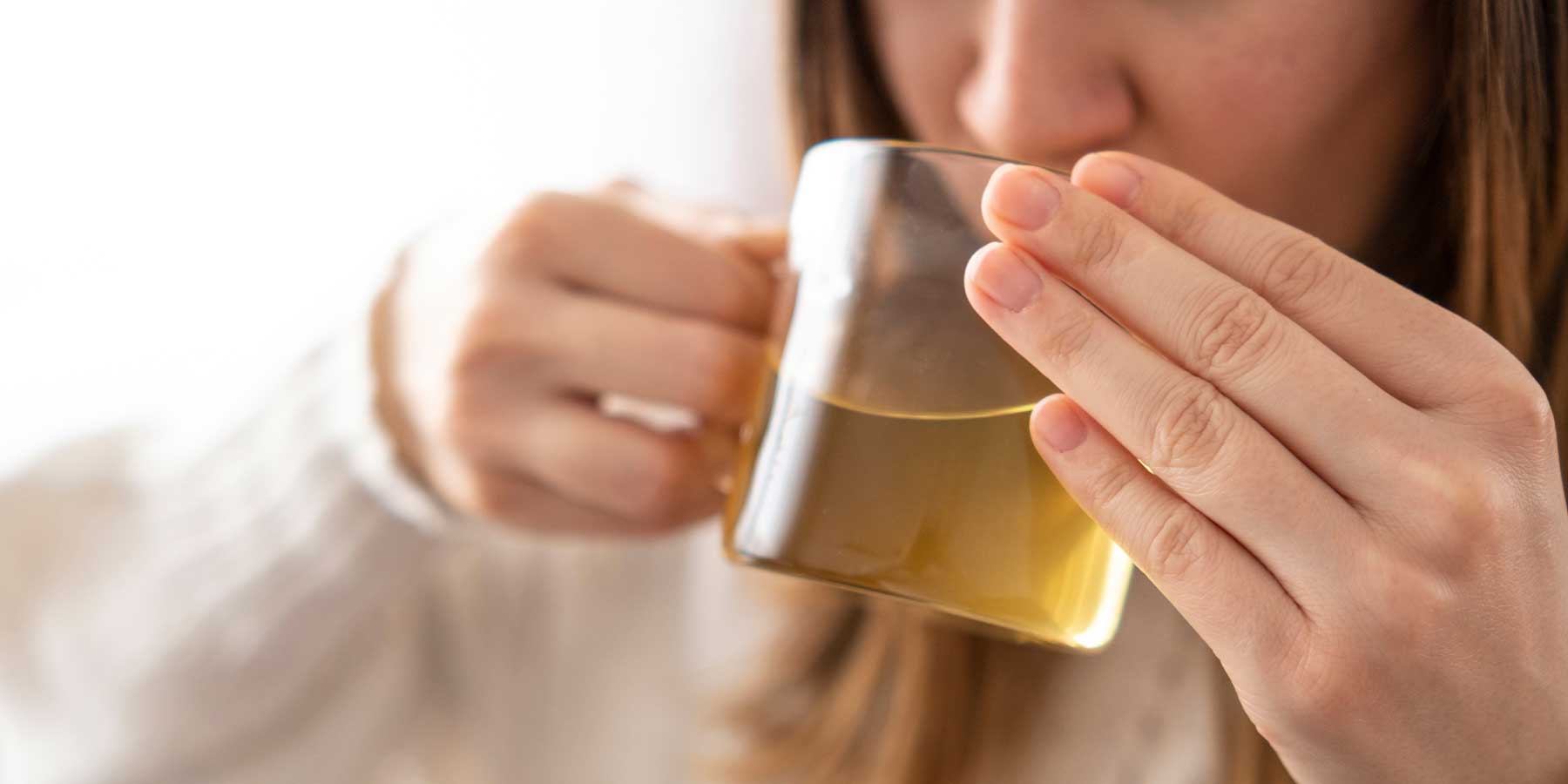 girl drinking cup of green tea for weightloss