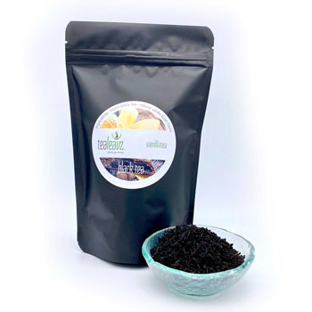 vanilla tea in dish alongside pouch of tea