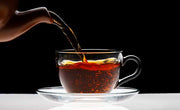 what makes black tea black? pouring black tea into cup