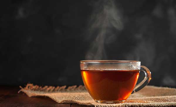 steaming cup of black tea discover the benefits of drinking black looose leaf tea