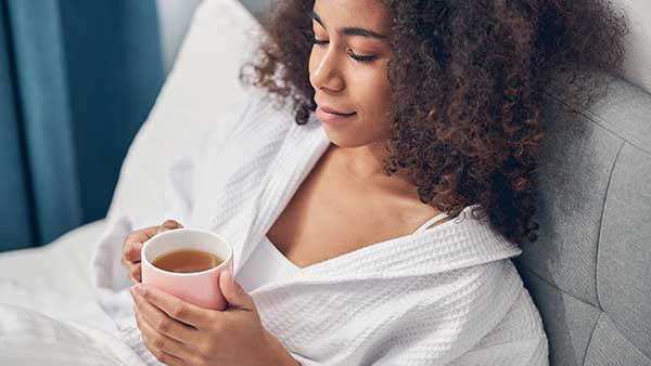 woman drinking best tea for relaxation and sleep at bedtime