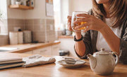 woman drinking cup of loose leaf tea for a weight-conscious routine