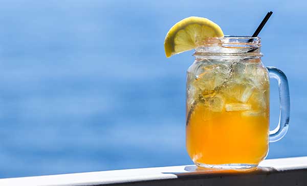 ice cold glass of cold brew green tea poolside