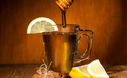 glass mug of starbuck's medicine ball tea