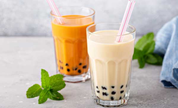 two glasses of boba tea, milk boba tea and fruit boba tea
