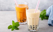 two glasses of boba tea, milk boba tea and fruit boba tea