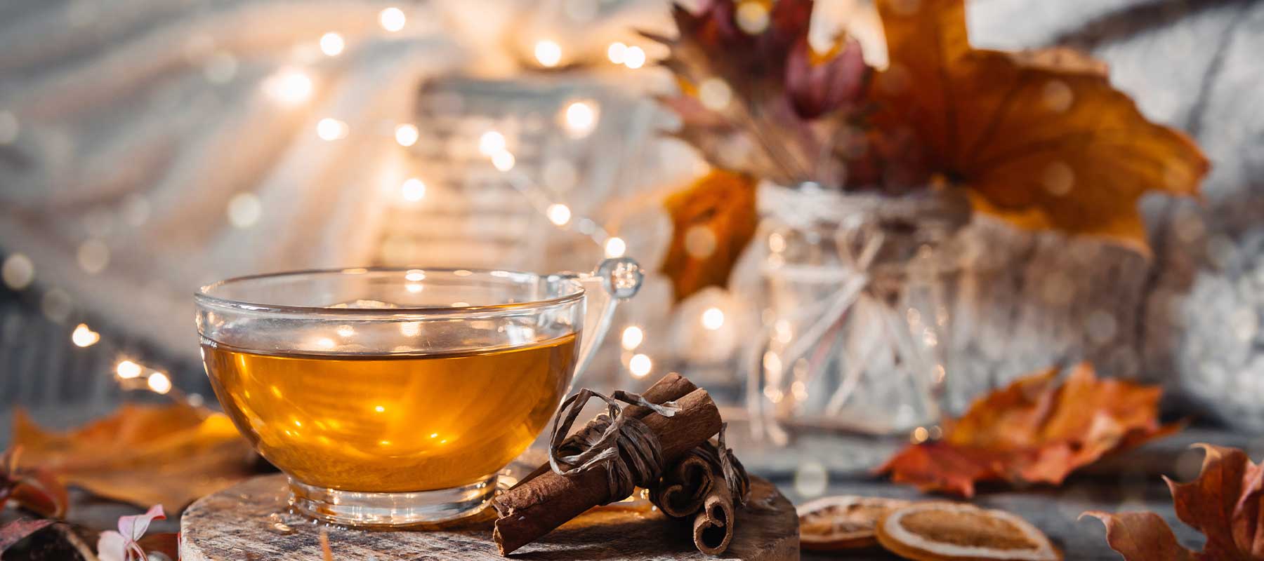 cup of fall tea surrounded with warmth
