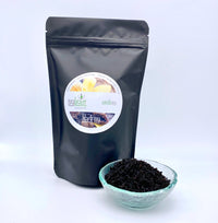 french vanilla tea in dish alongside pouch of tea