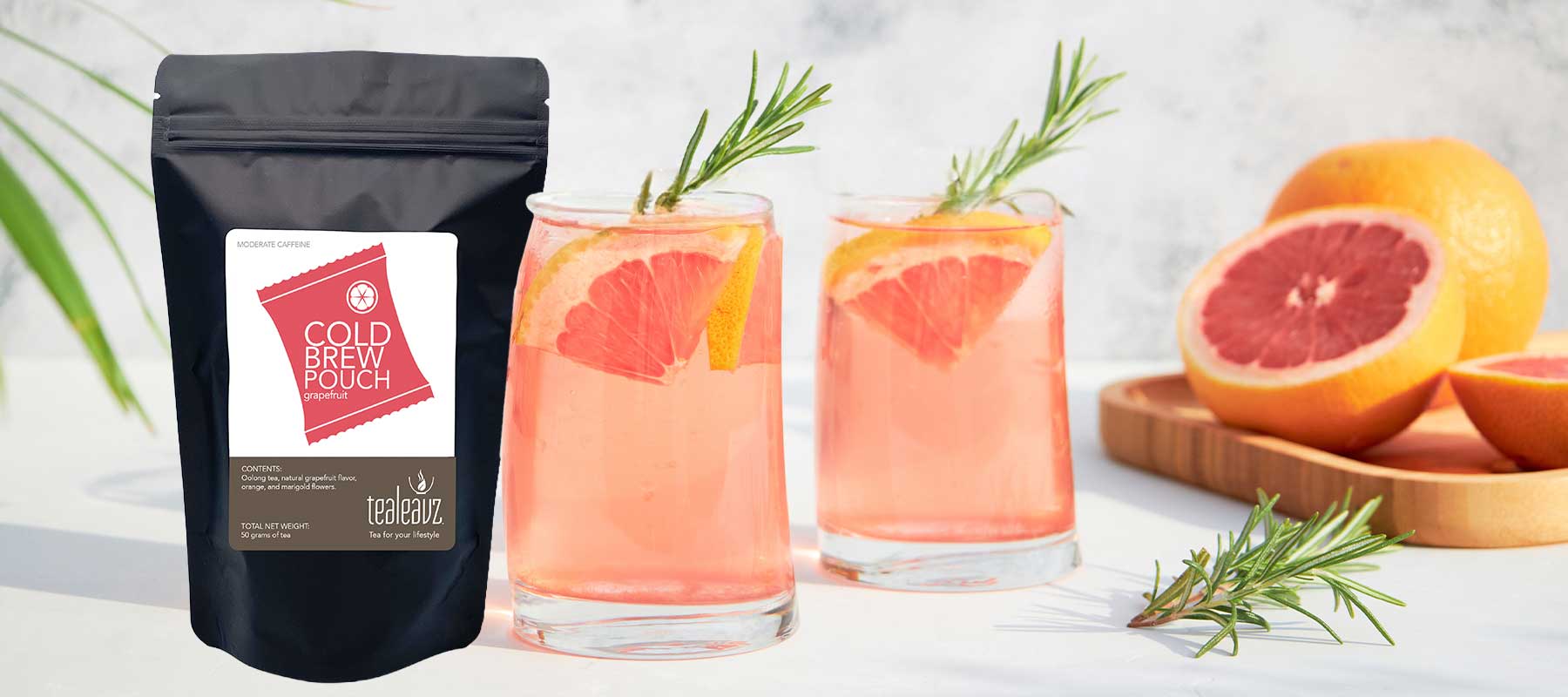 Cold brew grapefruit tea package with grapefruit on a light background