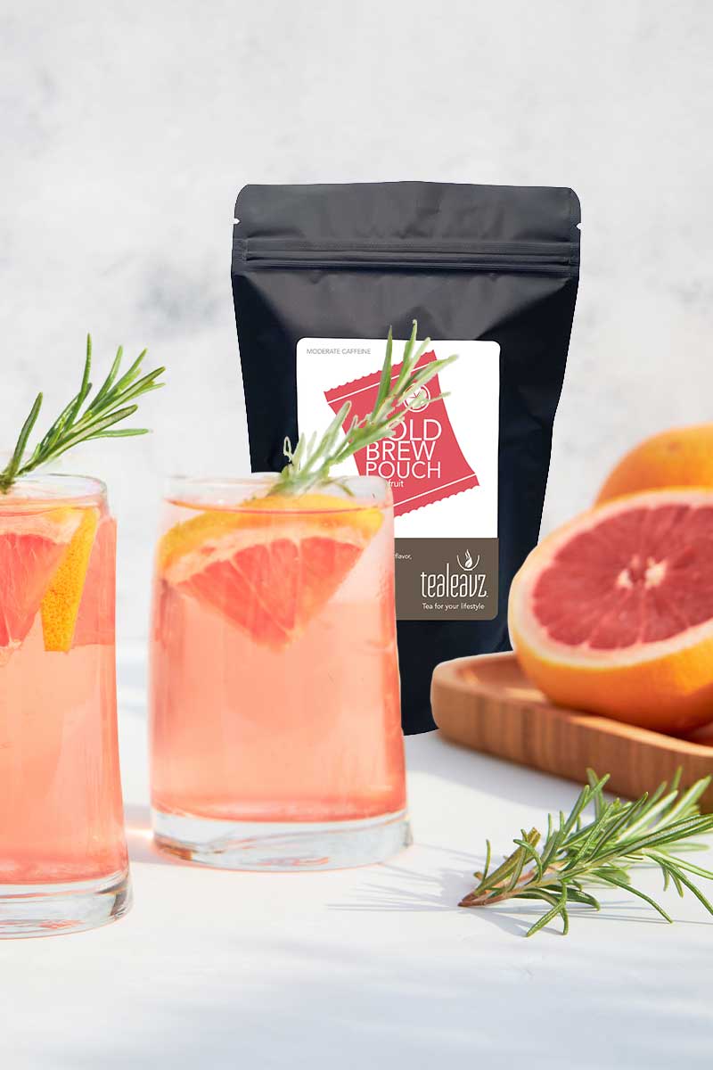 Two glasses of Cold brew grapefruit tea package with grapefruit on a light background