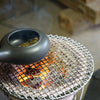 hojicha tea being roasted over charcoal