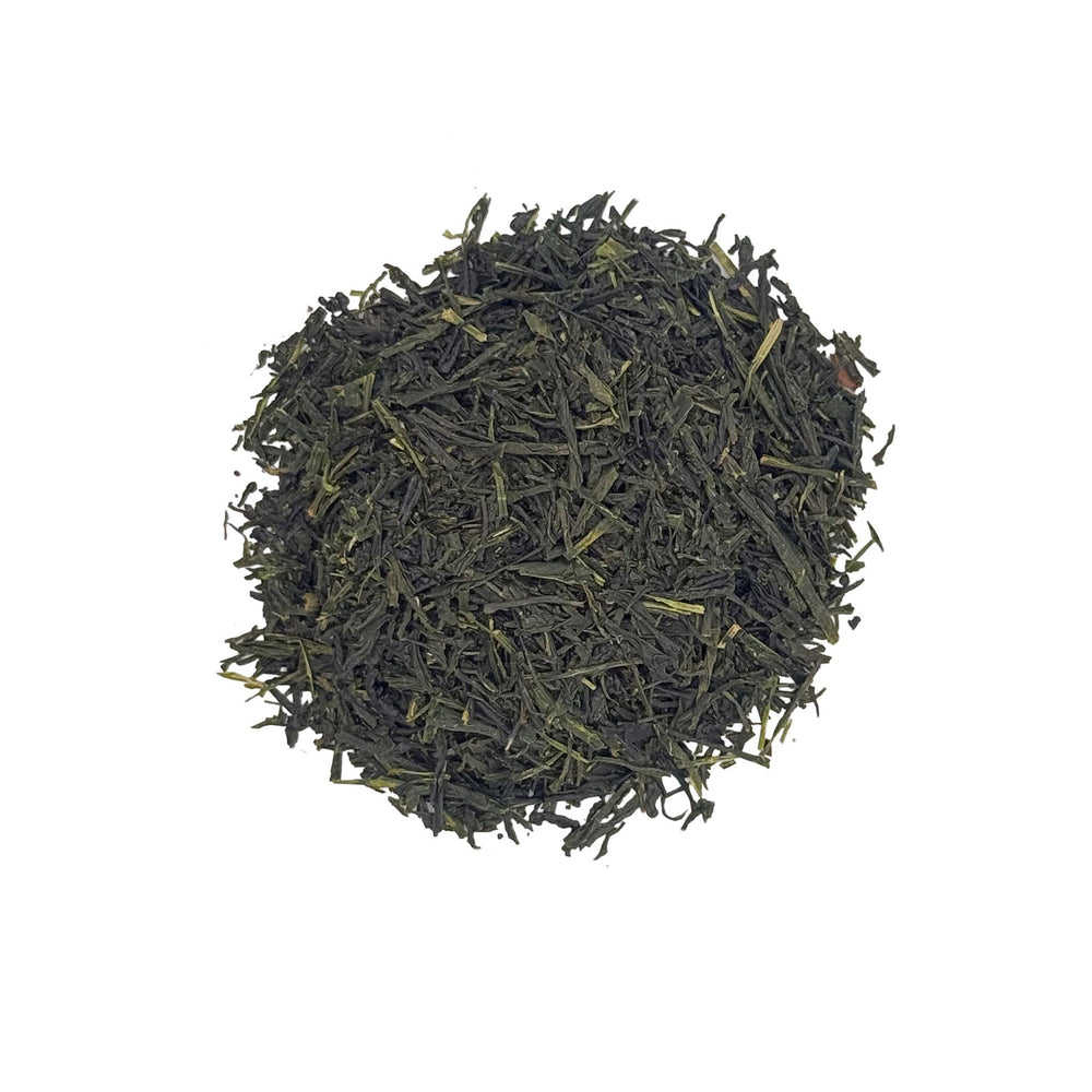 Japanese sencha tea leaves on a white background