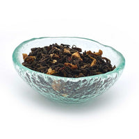 orange pu erh tea in dish