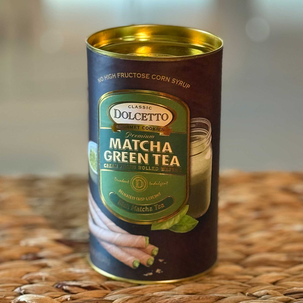 Can of Dolcetto Matcha Green Tea on a woven surface with a blurred background