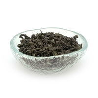 glass dish of ti kuan yin (or iron buddha tea)