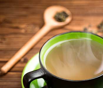 a steaming cup of Jade Oolong tea