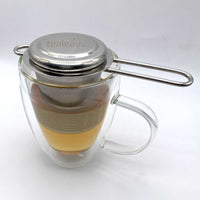 stainless steel tea strainer steeping tea in mug